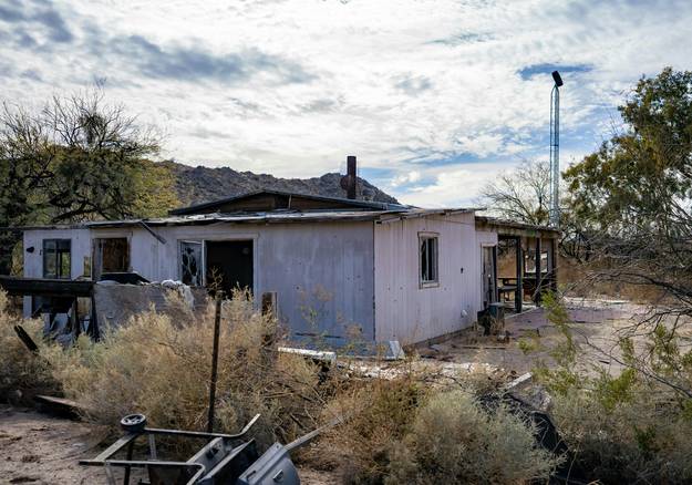 Arizona residential property with landlord and tenant reviewing eviction notice paperwork