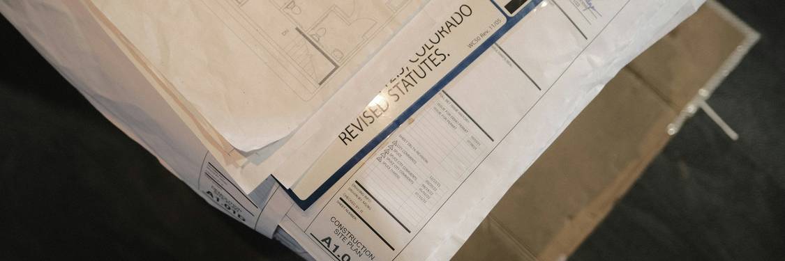 Stack of Arizona eviction notices and court documents on a desk