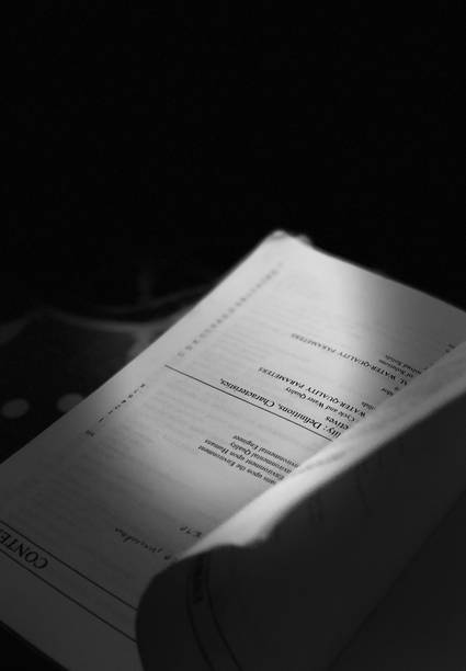 Arizona landlord reviewing rental agreement and notice paperwork at a desk