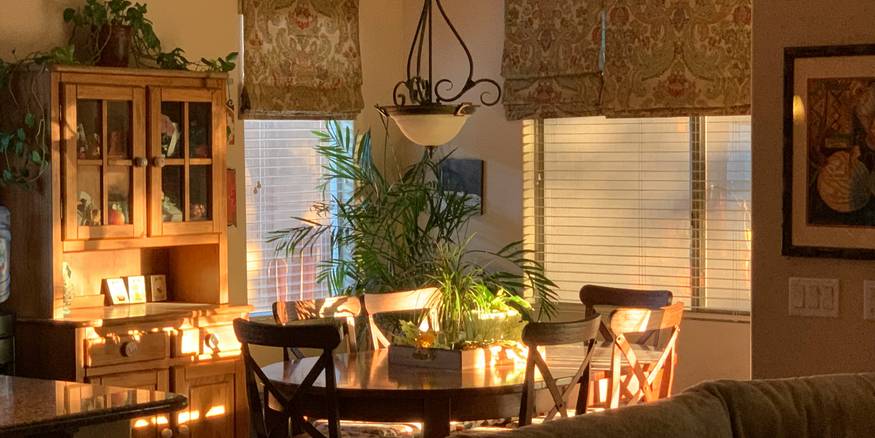 Arizona landlord reviewing repair checklist in a rental home living room