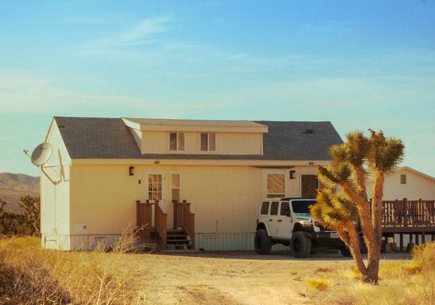 Landlord and tenant reviewing a rental application in a Southwest-style Arizona home