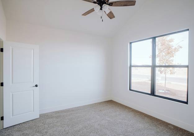 Landlord and tenant reviewing a rental application in a Southwest-style Arizona home