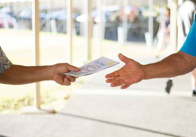 Landlord and tenant exchanging security deposit receipt at rental move-in in Arizona