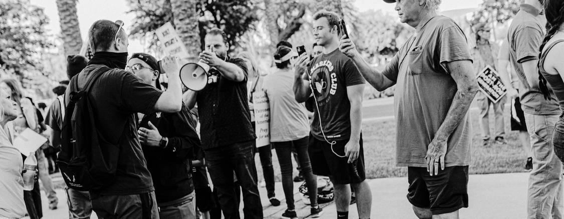 Tenants meeting with their attorney outside an Arizona courthouse to prepare for an eviction hearing