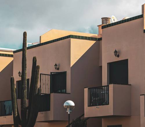 Arizona apartment exterior with tenant submitting maintenance request letter