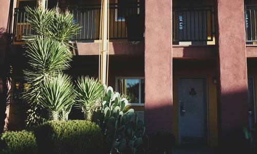 Arizona landlord reviewing eviction notice paperwork at a rental property